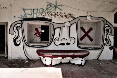 Graffiti on wall of old building