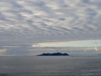 Scenic view of sea against sky at sunset