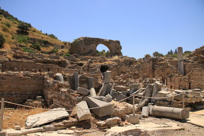 Low angle view of old ruins against clear sky at ephesus in turkey