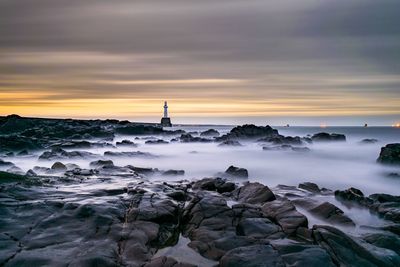 Scenic view of sea at sunset