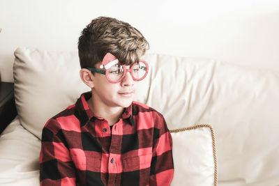 Portrait of boy wearing hat at home