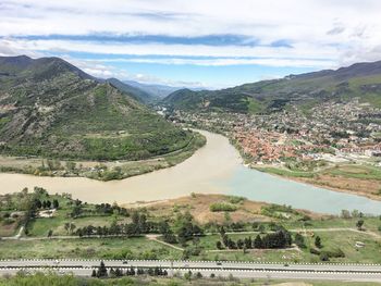 Scenic view of landscape and mountains against sky