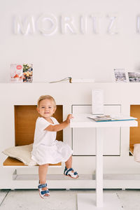 Portrait of a smiling girl on table