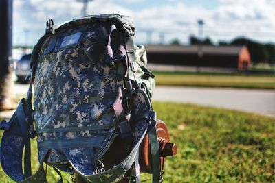 Close-up of army bag on field