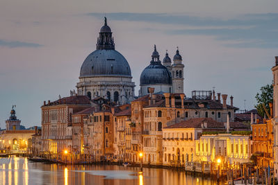 The basilica di santa maria della salute and the canale grande in venice before sunrise