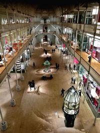 High angle view of people in illuminated room