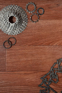 Close-up of bicycle chain and gear on table