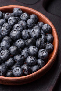 High angle view of blueberries in bowl on table