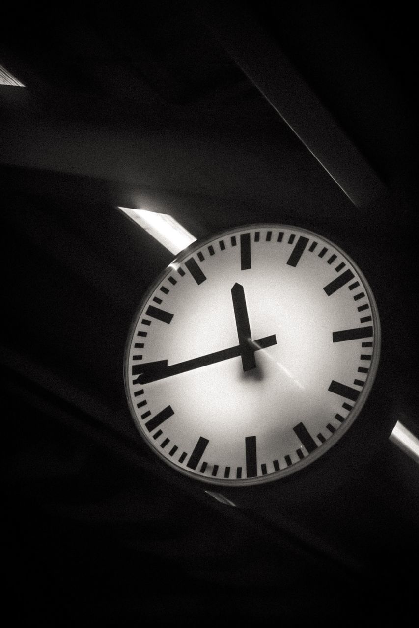 LOW ANGLE VIEW OF CLOCK ON CEILING