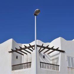 Low angle view of built structure against blue sky