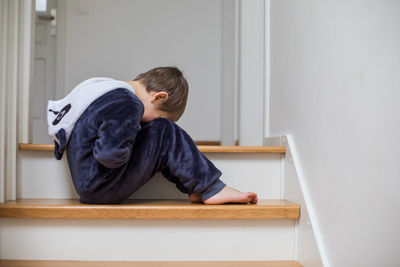 Boy sitting at home