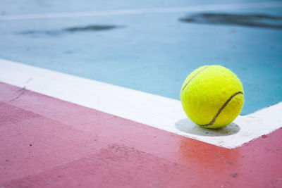 Close-up of yellow ball on table