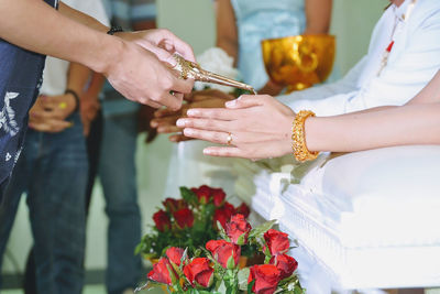 Cropped image of people during wedding ceremony