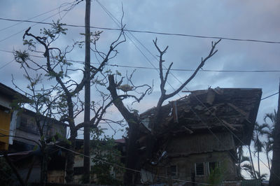 Low angle view of abandoned building against sky