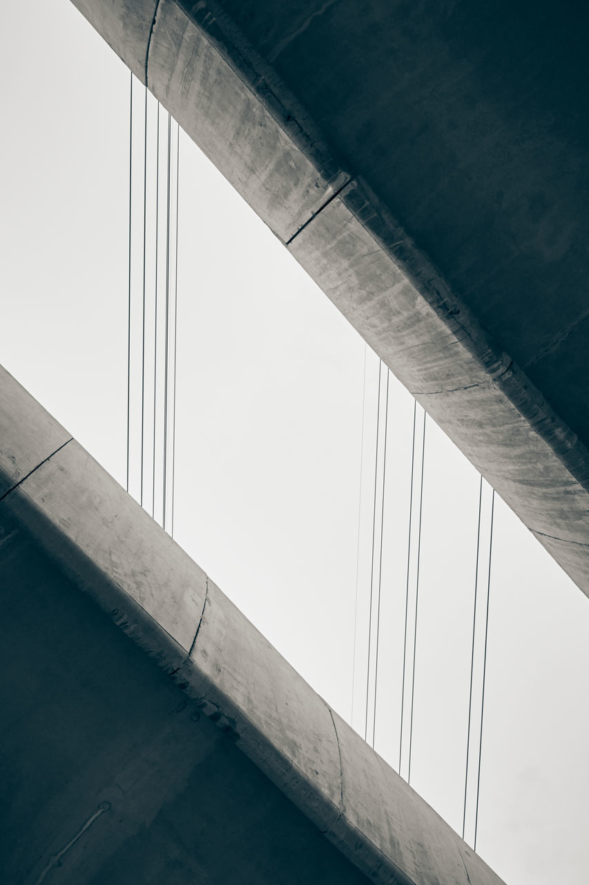 LOW ANGLE VIEW OF BRIDGE AGAINST CLEAR SKY