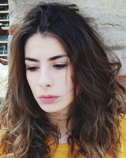 Close-up of thoughtful young woman with long hair