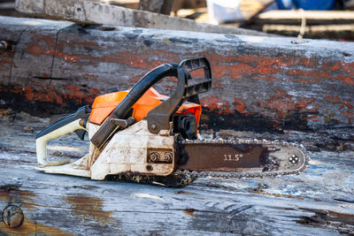 Close-up of equipment on log