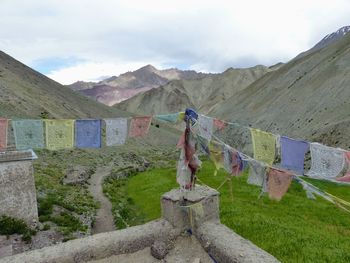 Clothes drying on mountain against sky