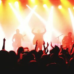 Rear view of people enjoying music concert