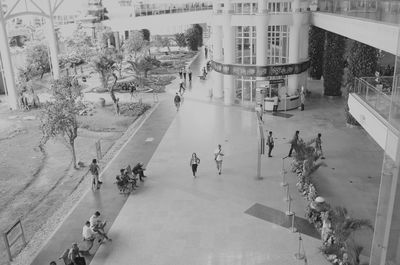 High angle view of people walking on road