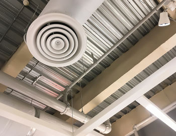 Low angle view of spiral staircase in building