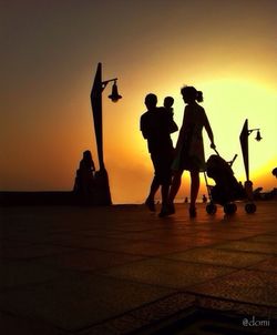 Silhouette of people at sunset