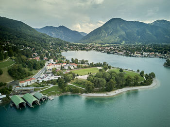 High angle view of river amidst mountains against sky