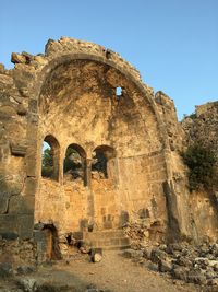 Low angle view of old ruin building against sky