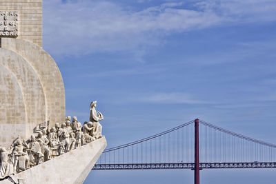 Monument to the discoveries and ponte 25 de abril. lisbon, portugal