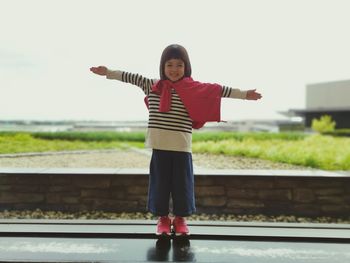 Portrait of girl standing outdoors