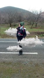 Man cycling on road