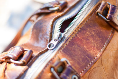 Close-up of zip on leather bag