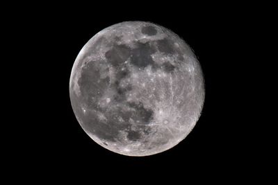 Scenic view of full moon against sky at night