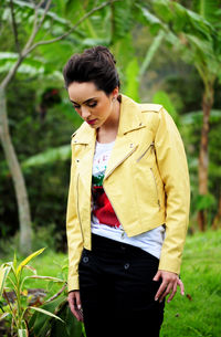 Young woman standing on field