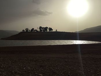 Scenic view of beach against sky during sunset