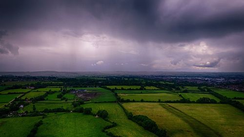 Scenic view of agricultural field against sky at night