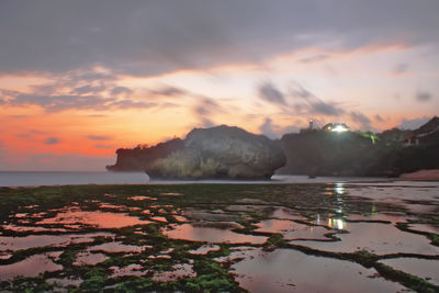 Scenic view of sea against sky at sunset