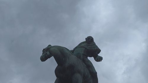 Low angle view of statue against sky