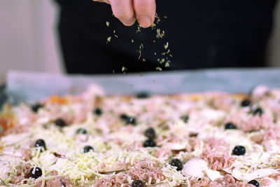 Close-up of person preparing food
