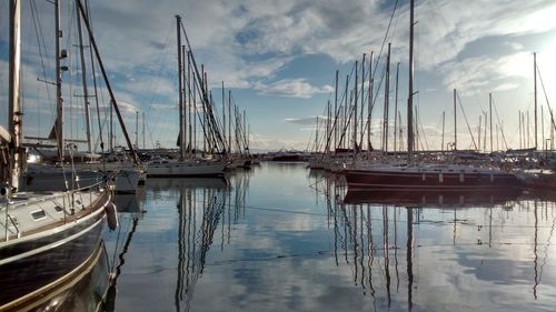 Boats moored at harbor