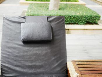 High angle view of wooden seat on table