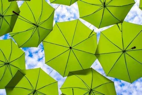 LOW ANGLE VIEW OF MULTI COLORED UMBRELLA