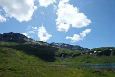 Scenic view of landscape and mountains against sky