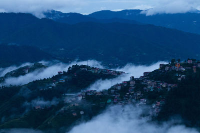 High angle view of buildings in city against sky