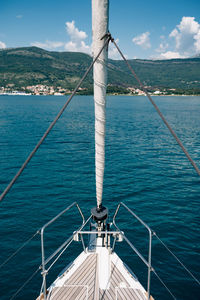 Sailboat sailing on sea against sky