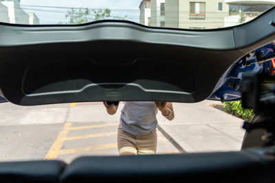 Low section of woman walking on street