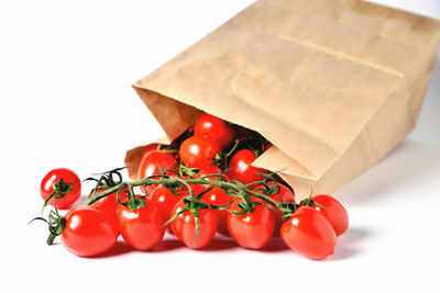 Close-up of tomatoes against white background