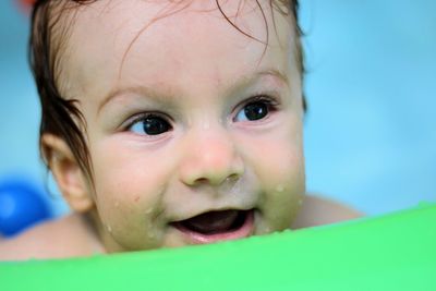 Close-up of cute baby boy in swimming pool