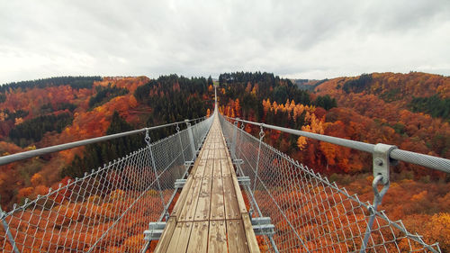 Bridge in autumn against sky