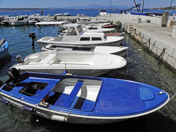 Boats moored at harbor